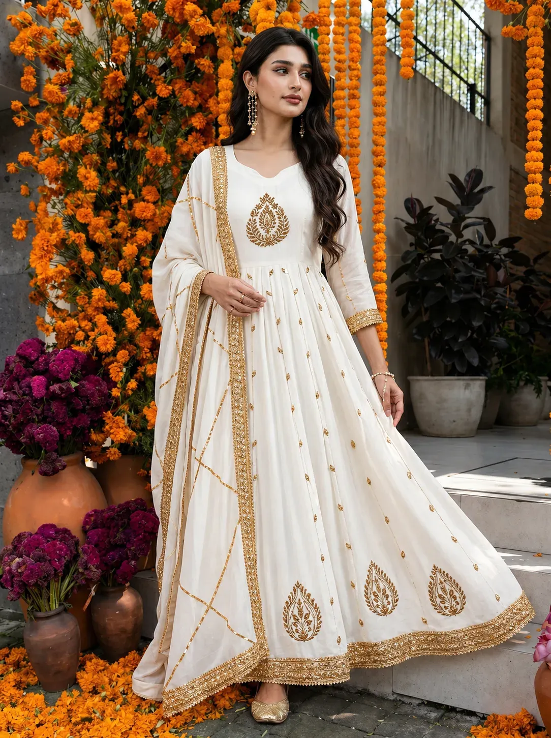Model wearing an embroidered Anarkali suit